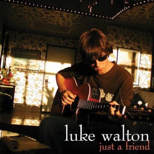 Cover for Just a Friend. Luke Walton playing guitar in a sunlit room, the title at the lower right.